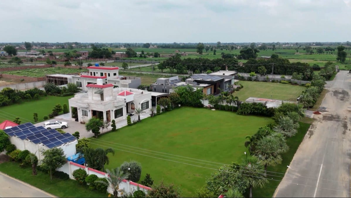 An established farmhouse residence with solar and generous lawns
