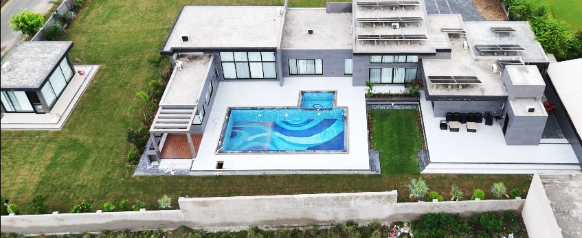 A finished farmhouse residence with private pool — the Farmerz Farmz standard
