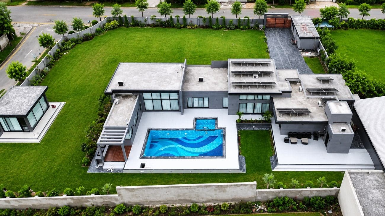 A private farmhouse estate with swimming pool and landscaped lawns at Flaura Farms