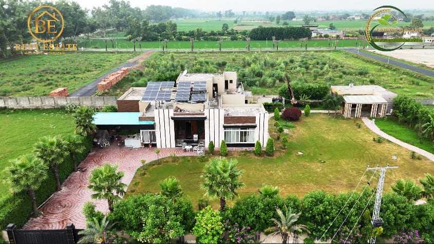 Farmhouse with solar panels and an open lawn