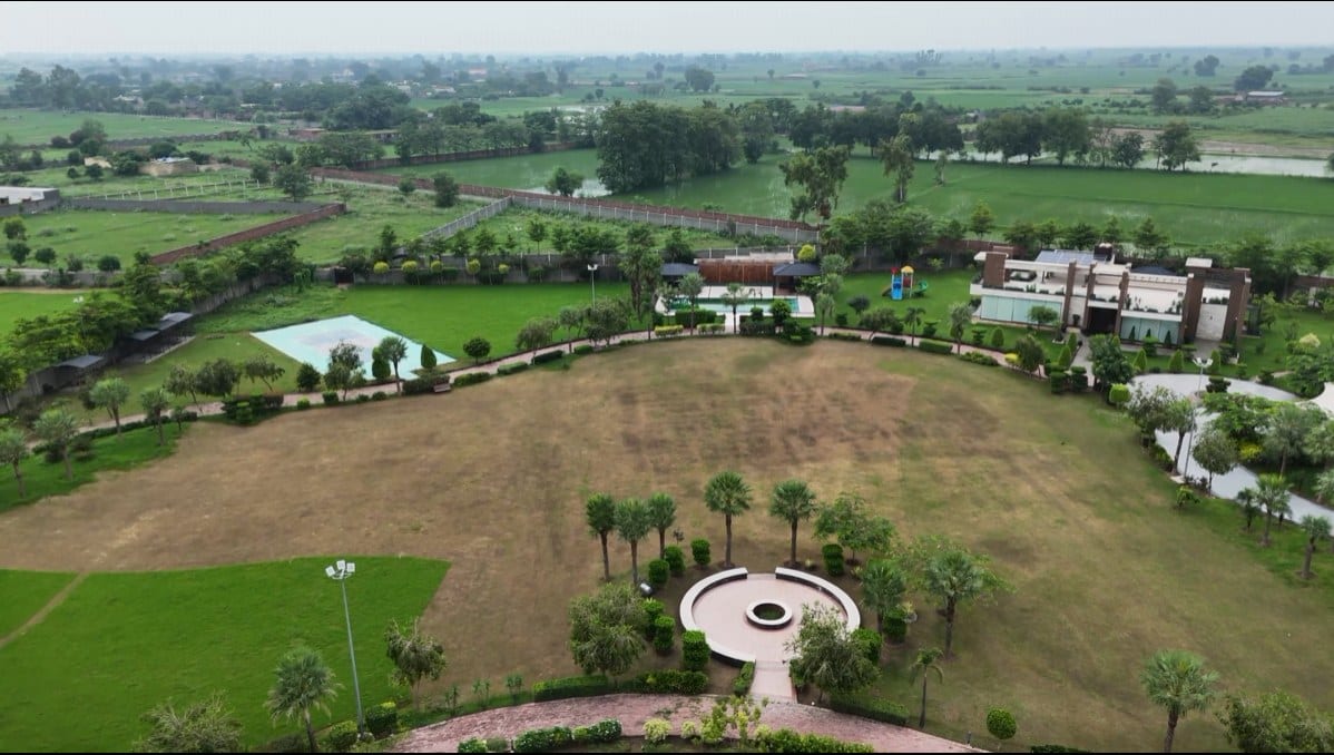 A landscaped lawn with private pool and pavilion